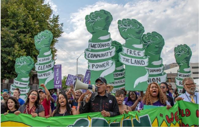 Multiracial climate activists marching in Detroit